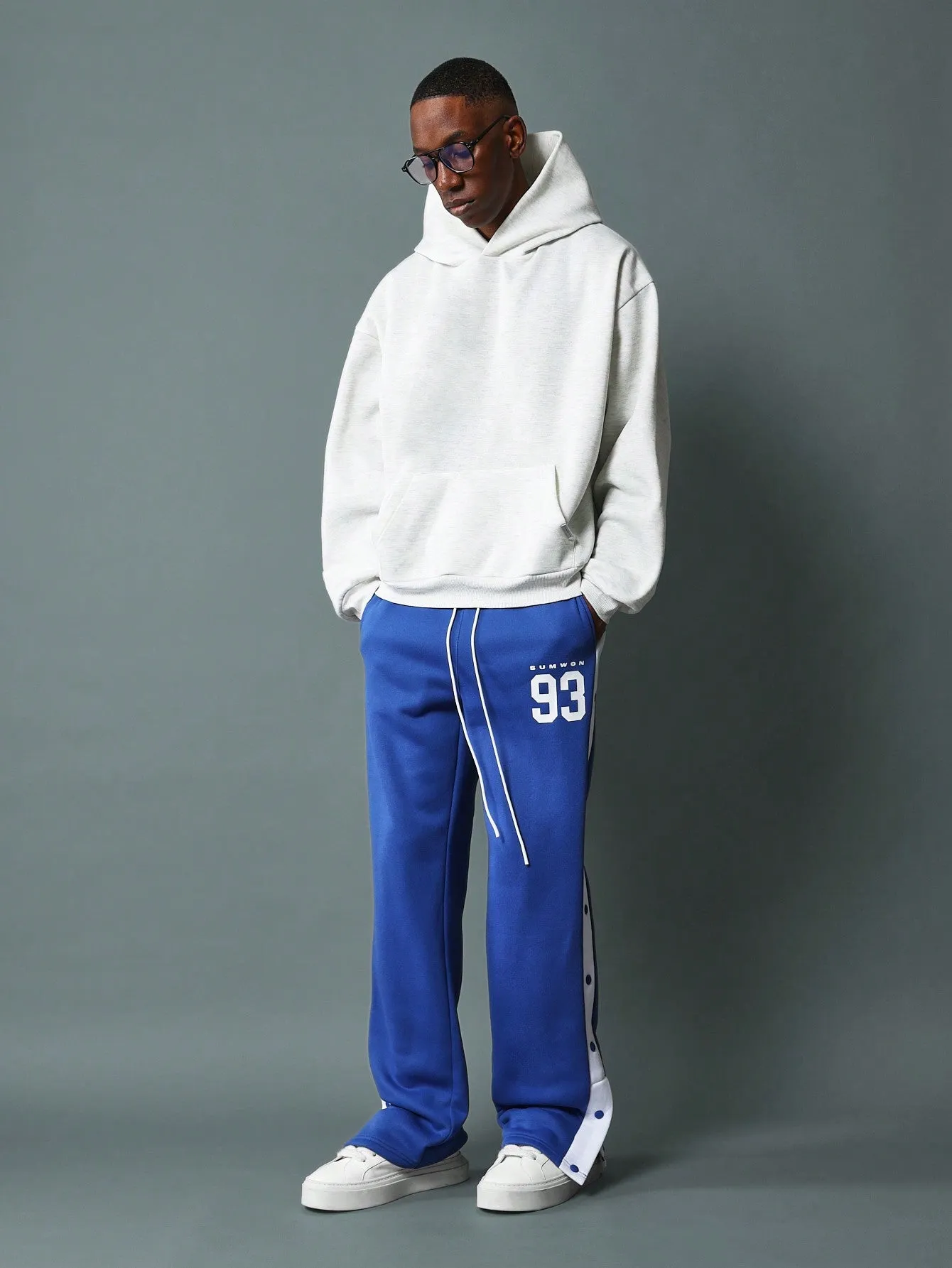 Straight Fit Drop Crotch Sweatpants With Contras Colour Side Panel, Snap Button & Graphic Print