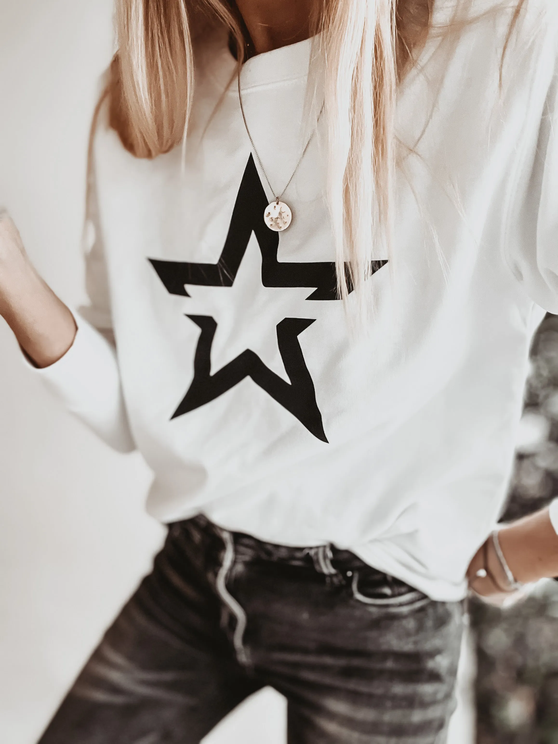 White sweatshirt with a striking black star *boyfriend fit*