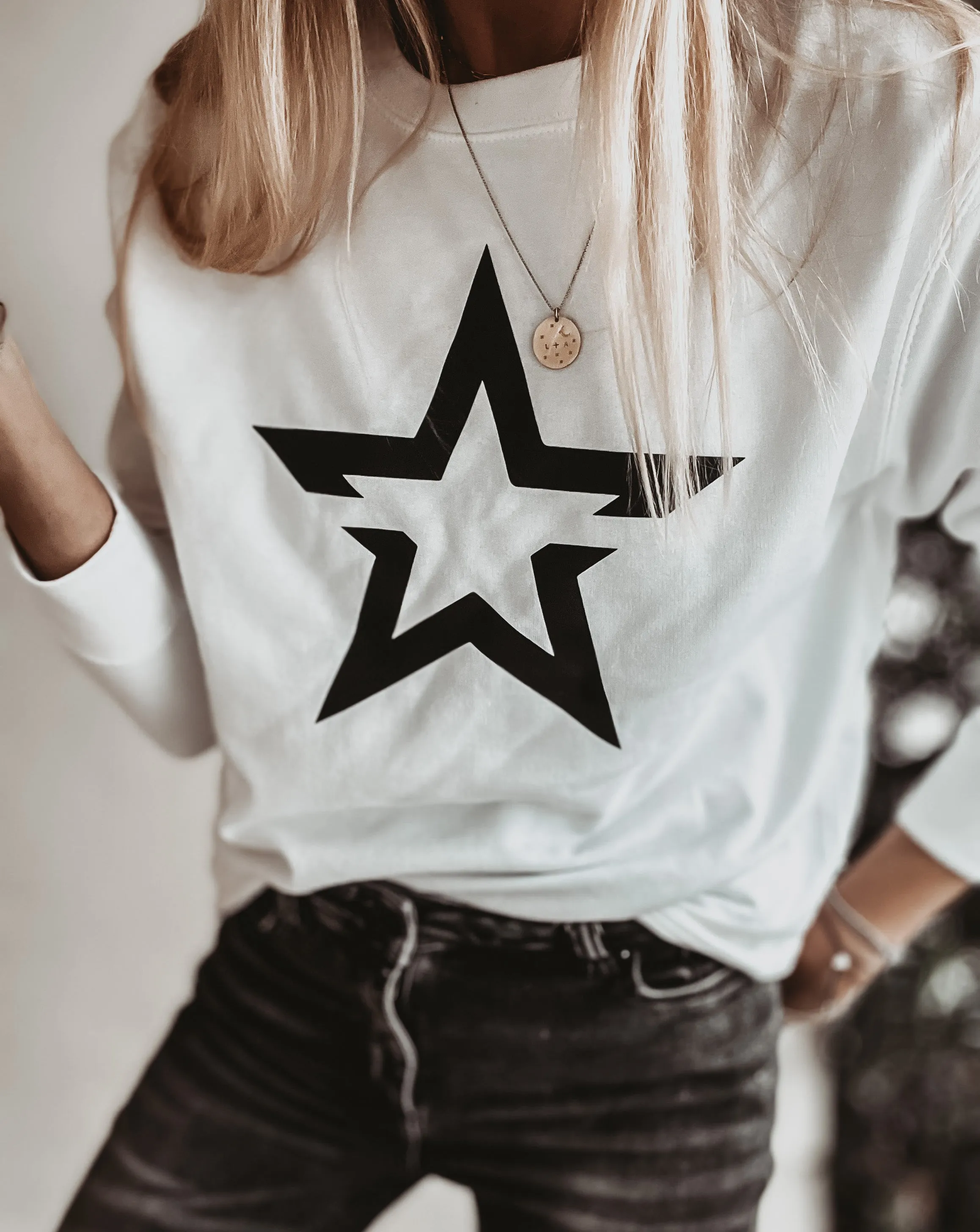 White sweatshirt with a striking black star *boyfriend fit*